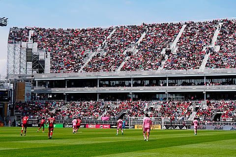 Fans watch from temporary stands at BMO Field, which were built to accommodate more fans for the 2026 World Cup, during first half MLS soccer between Toronto FC and Inter Miami CF, in Toronto.