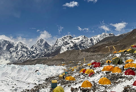 Mountaineers' and guides' tents are spread over at the base camp of Mount Everest, Nepal.