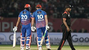 AP Photo/Ashwini Bhatia : Delhi Capitals' captain Axar Patel talks to teammate David Miller as later comes out to play during the Indian Premier League cricket match between Delhi Capitals and Punjab Kings in Dharamshala, India, Monday, May 11, 2026.