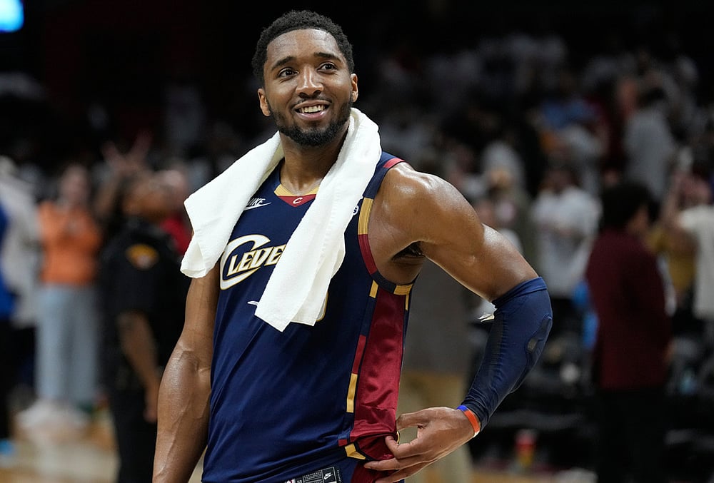 Cleveland Cavaliers guard Donovan Mitchell (45) smiles as fans cheer while he is interviewed after the Cavaliers defeated the Detroit Pistons in Game 3 of a second-round NBA playoffs basketball series in Cleveland.  - | Photo: AP/Sue Ogrocki