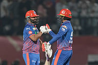 | Photo: AP/Ashwini Bhatia : Delhi Capitals' Auqib Nabi with teammate Madhav Tiwari celebrate after wining against Punjab Kings during the Indian Premier League cricket match in Dharamshala, India.