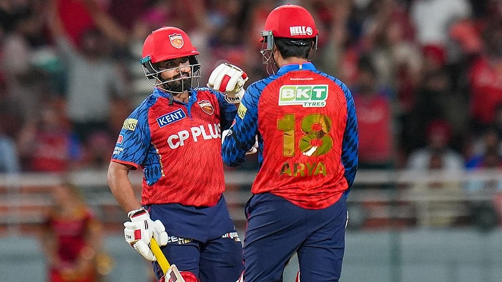 Punjab Kings' Priyansh Arya, right, and Prabhsimran Singh interact between the wickets during the Indian Premier League (IPL) 2026 T20 cricket match between Punjab Kings and Rajasthan Royals, in Mullanpur. - | Photo: PTI/Shiva Sharma