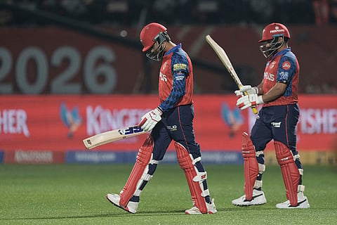 Punjab Kings' Priyansh Arya, left, and Punjab Kings' Prabhsimran Singh walk out to bat during the Indian Premier League cricket match between Delhi Capitals and Punjab Kings in Dharamshala, India.
