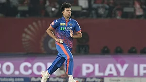 AP Photo/Ashwini Bhatia : Delhi Capitals' Madhav Tiwari runs into bowl during the Indian Premier League cricket match between Delhi Capitals and Punjab Kings in Dharamshala, India, Monday, May 11, 2026.