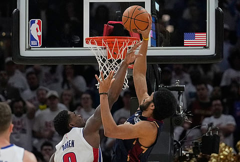 Cleveland Cavaliers center Jarrett Allen, right, dunks as Detroit Pistons center Jalen Duren (0) defends in the second half of Game 3 of a second-round NBA playoffs basketball series in Cleveland. 