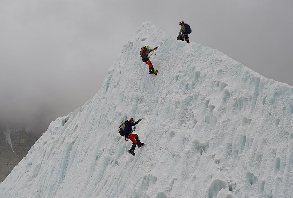 Mountaineers participate in a training session at the Khumbu Icefall as they prepare for their ascent to the summit of Mount Everest, Nepal. - | Photo: AP/Pasang Rinzee Sherpa