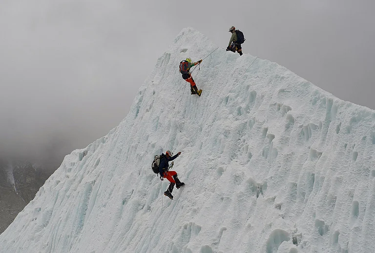 Mountaineers participate in a training session at the Khumbu Icefall as they prepare for their ascent to the summit of Mount Everest, Nepal. - | Photo: AP/Pasang Rinzee Sherpa