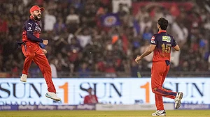 | Photo: PTI/Atul Yadav : Royal Challengers Bengaluru's Bhuvneshwar Kumar celebrates with teammate Virat Kohli, left, after he dismisses Mumbai Indians' Suryakumar Yadav during an Indian Premier League (IPL) 2026 T20 match.