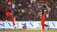 | Photo: PTI/Atul Yadav : Royal Challengers Bengaluru's Bhuvneshwar Kumar celebrates with teammate Virat Kohli, left, after he dismisses Mumbai Indians' Suryakumar Yadav during an Indian Premier League (IPL) 2026 T20 match.