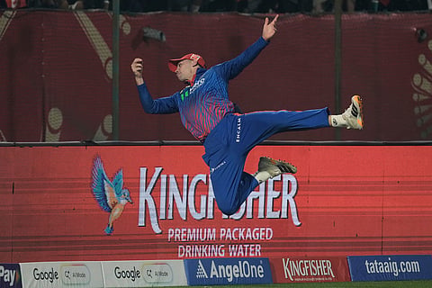 Delhi Capitals' Tristan Stubbs attempts unsuccessfully to take a catch during the Indian Premier League cricket match between Delhi Capitals and Punjab Kings in Dharamshala, India.