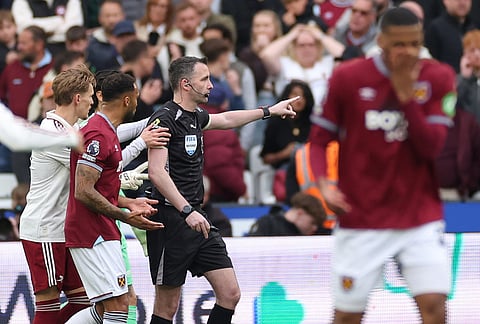 Players appeal to referee Chris Kavanagh after he disallowed a goal by West Ham's Callum Wilson during the Premier League soccer match between West Ham and Arsenal in London.