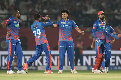 Delhi Capitals' Madhav Tiwari, center, celebrates the wicket of Punjab Kings' Priyansh Arya with teammates during the Indian Premier League cricket match between Delhi Capitals and Punjab Kings in Dharamshala, India.