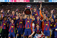 Barcelona 2-0 Real Madrid La Liga 2025-26 El Clasico: Hansi Flick's Side Clinch Title Victory As Rashford, Torres Score | Photo: AP/Joan Monfort : Barcelona players lift the trophy after winning the Spanish La Liga soccer match against Real Madrid to clinch the Spanish league title in Barcelona, Spain.