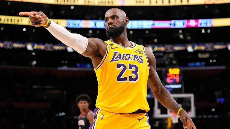 Los Angeles Lakers forward LeBron James gestures after scoring during the second half in Game 1 of a first-round NBA playoffs basketball series against the Houston Rockets in Los Angeles. - | Photo: AP/Mark J. Terrill