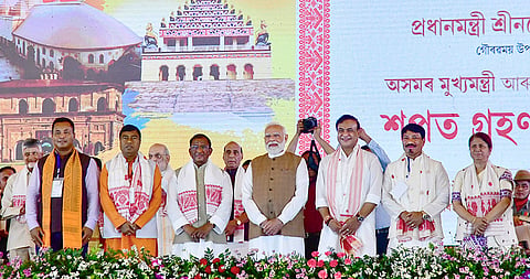 Prime Minister Narendra Modi with Assam Governor Lakshman Prasad Acharya, newly sworn-in state Chief Minister Himanta Biswa Sarma, newly sworn-in state Ministers Ajanta Neog, Rameswar Teli, Atul Bora and Charan Boro during the swearing-in ceremony, at Khanapara in Guwahati.