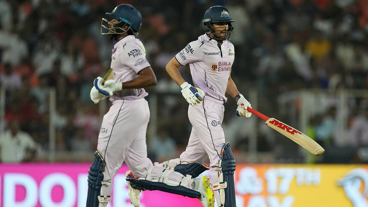 Gujarat Titans' captain Shubman Gill, right and Sai Sudharsan run between the wickets to score during the Indian Premier League cricket match between Gujarat Titans and Sunrisers Hyderabad, in Ahmedabad, India, Tuesday, May 12, 2026 - (AP Photo/Ajit Solanki)
