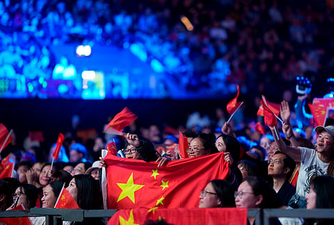 China fans watch their team beat Japan in the men's final of the World Team Table Tennis Championships in London.