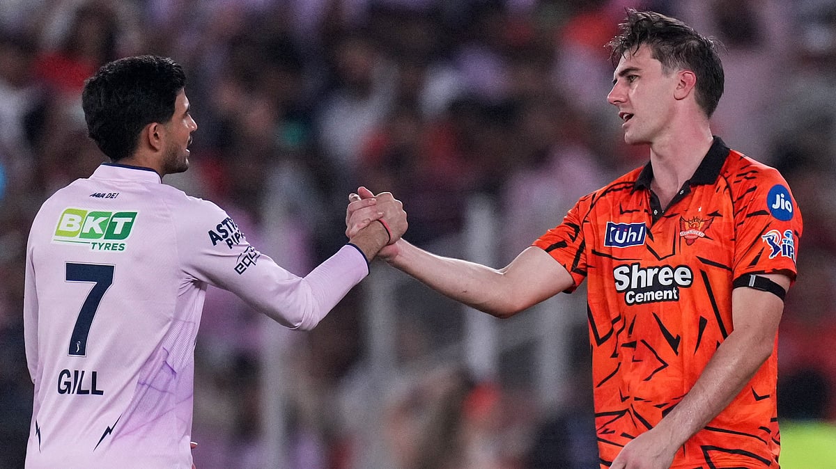 Gujarat Titans' captain Shubman Gill, left and Sunrisers Hyderabad's Pat Cummins shake hands after Gujarat Titans won the match during the Indian Premier League cricket, in Ahmedabad, India, Tuesday, May 12, 2026 - (AP Photo/Ajit Solanki)
