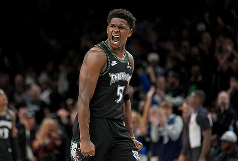 Minnesota Timberwolves guard Anthony Edwards (5) reacts after scoring against the San Antonio Spurs during the second half of Game 4 of an NBA basketball second-round playoffs series in Minneapolis.