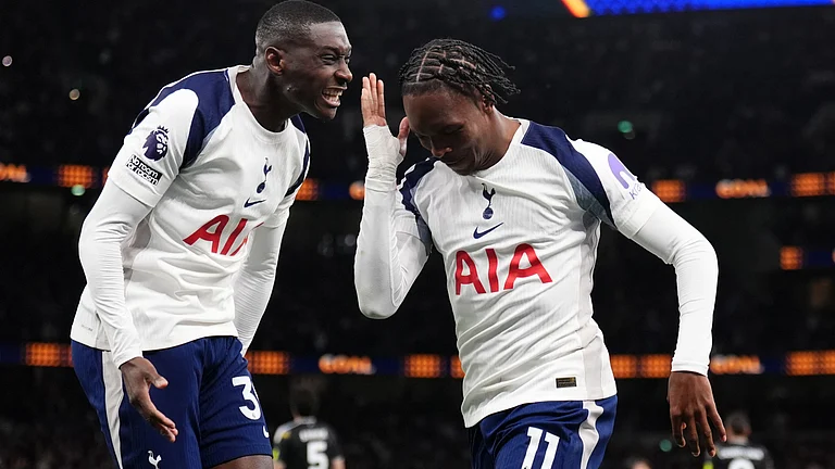 Tottenham Hotspur's Mathys Tel, right, celebrates scoring during the English Premier League soccer match between Tottenham Hotspur and Leeds United in London, Monday May 11, 2026. - | Photo: AP/John Walton