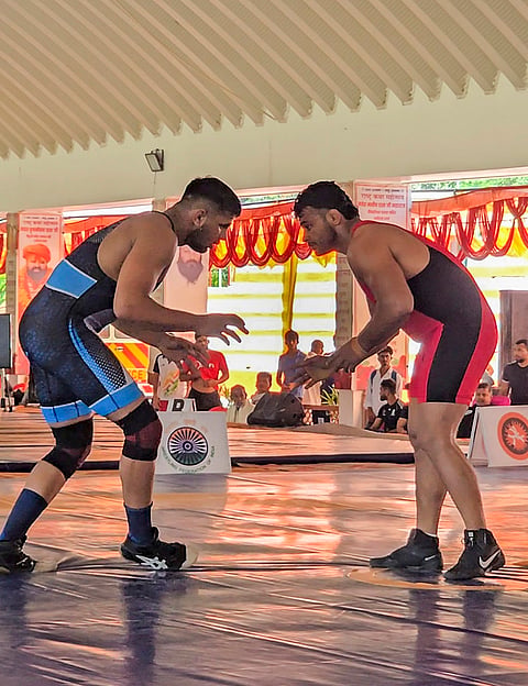Wrestler Deepak Punia, right, in action during the '92 kg National Open Ranking Tournament 2026', in Gonda, Uttar Pradesh. 