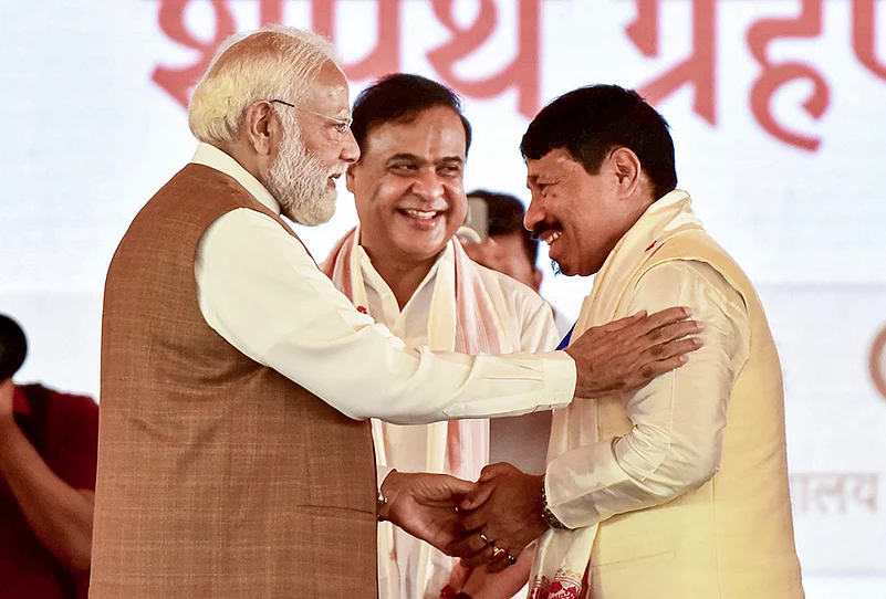 Modi with Himanta Biswa Sarma and Atul Bora
