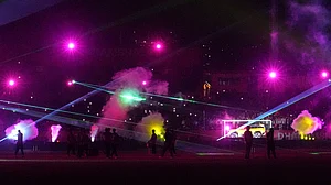 | Photo: AP/Ashwini Bhatia : A laser show lights up the sky during the Indian Premier League cricket match between Delhi Capitals and Punjab Kings in Dharamshala, India, Monday, May 11, 2026.