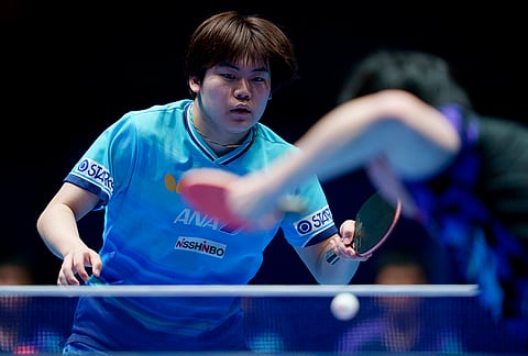 Sora Matsushima of Japan in action against Wang Chuqin of China in their men's final match during the World Team Table Tennis Championships in London.