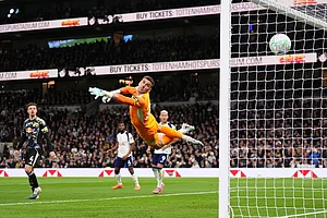| Photo: John Walton/PA via AP : Tottenham Hotspur's Mathys Tel scores during the English Premier League soccer match between Tottenham Hotspur and Leeds United in London.