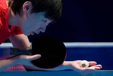 Manyu Wang of China serves against Miwa Harimoto of Japan in their Women's Final match during the World Team Table Tennis Championships in London.