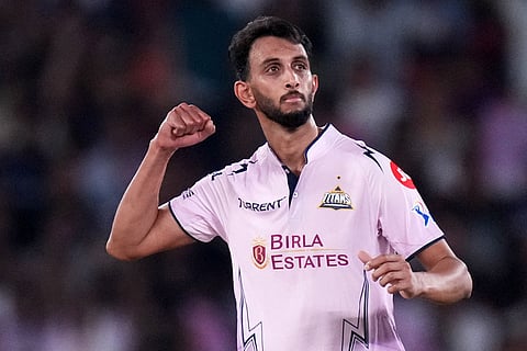 Gujarat Titans' Prasidh Krishna celebrates the wicket of Sunrisers Hyderabad's Salil Arora during the Indian Premier League cricket match between Gujarat Titans and Sunrisers Hyderabad, in Ahmedabad, India.