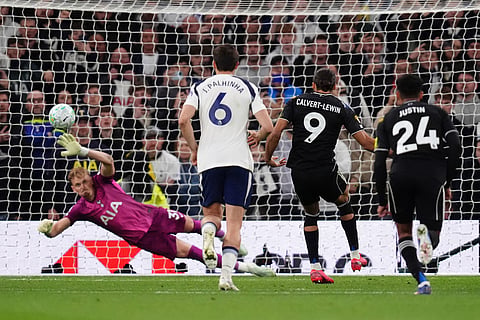 Leeds United's Dominic Calvert-Lewin scores their side's first goal of the game from a penalty during the English Premier League soccer match between Totteham Hotspur and Leeds United in London.