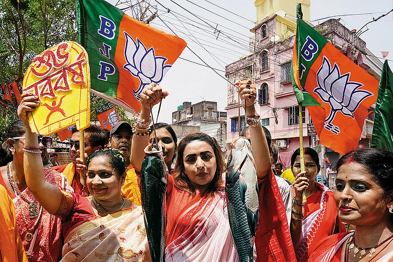 BJP supporters in West Bengal celebrate with fish during the Bengali New Year in Kolkata