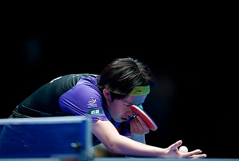 Wang Chuqin of China in action against Sora Matsushima of Japan in their men's final match during the World Team Table Tennis Championships in London.