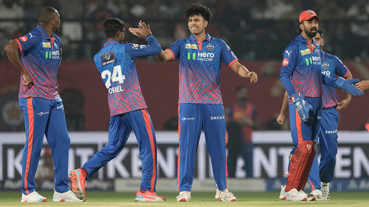 Delhi Capitals' Madhav Tiwari, center, celebrates the wicket of Punjab Kings' Priyansh Arya with teammates during the Indian Premier League cricket match between Delhi Capitals and Punjab Kings in Dharamshala, India, Monday, May 11, 2026.  - | Photo: AP/Ashwini Bhatia