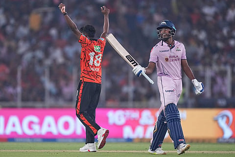 Sunrisers Hyderabad's Sakib Hussain, left, celebrates the wicket of Gujarat Titans' Sai Sudharsan, right during the Indian Premier League cricket match between Gujarat Titans and Sunrisers Hyderabad, in Ahmedabad, India.