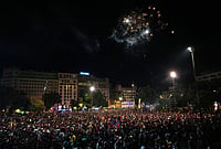 | Photo: AP/Joan Mateu Parra : FC Barcelona fans celebrate on the street after winning the Spanish La Liga soccer championship with three rounds to spare, in Barcelona, Spain.