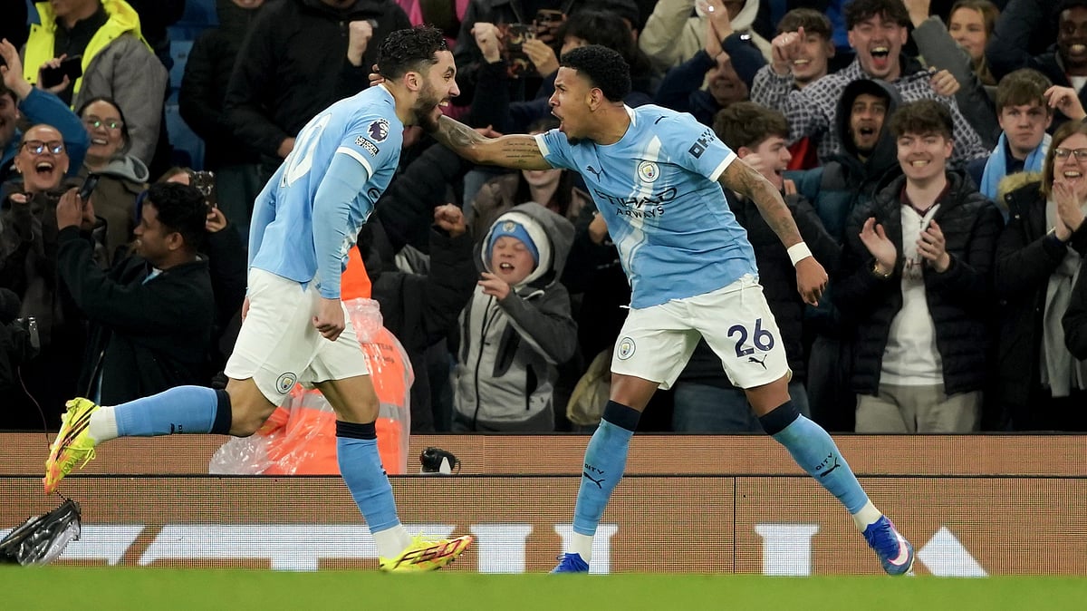 Manchester City's Savinho, celebrates with Manchester City's Rayan Cherki after scoring his side's third goal during the English Premier League football match between Manchester City and Crystal Palace in Manchester, England. - AP Photo