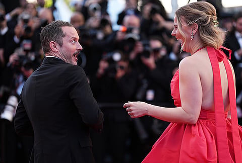 Elijah Wood, left, and Mette-Marie Kongsved pose for photographers at the opening ceremony and premiere of the film 'The Electric Kiss' during 79th international film festival, Cannes, southern France.