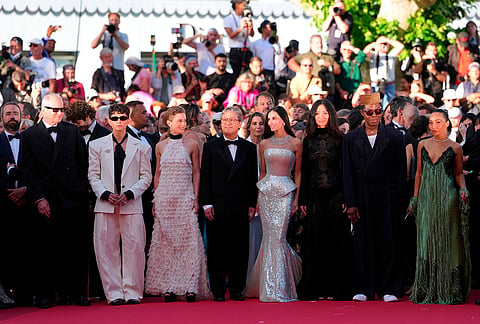 Jury president Park Chan-wook, fourth from left, poses with jury members Stellan Skarsgård, from left, Diego Céspedes, Laura Wandel, Demi Moore, Chloé Zhao, Isaach de Bankolé and Ruth Negga at the opening ceremony and premiere of the film 'The Electric Kiss' during 79th international film festival, Cannes, southern France.