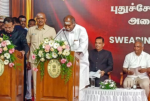 Puducherry LG K. Kailashnathan administers the oath of office to NDA leader N. Rangaswamy as the Chief Minister of Puducherry during a swearing-in ceremony.