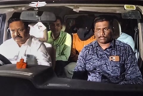 CBI officials take accused Shubham Khairnar into custody in connection with the NEET-UG 2026 paper leak case and leave for Delhi for further investigation, in Nashik, Tuesday, May 12, 2026. 