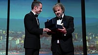Cannes 2026 | Peter Jackson Receives Honorary Palme d’Or From Elijah Wood Photo by Scott A Garfitt/Invision/AP : Elijah Wood, left, presents director Peter Jackson with the honorary Palme d'Or during the opening ceremony of the 79th international film festival, Cannes, southern France, Tuesday, May 12, 2026.