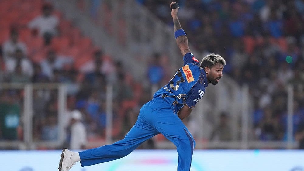 Mumbai Indians' captain Hardik Pandya bowls a delivery during the Indian Premier League cricket match between Gujarat Titans and Mumbai Indians in Ahmedabad. - | Photo: AP/Ajit Solanki