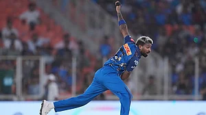 | Photo: AP/Ajit Solanki : Mumbai Indians' captain Hardik Pandya bowls a delivery during the Indian Premier League cricket match between Gujarat Titans and Mumbai Indians in Ahmedabad.