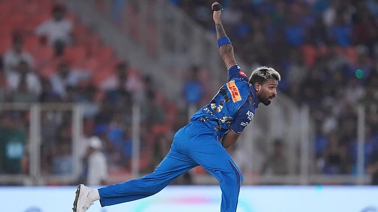 Mumbai Indians' captain Hardik Pandya bowls a delivery during the Indian Premier League cricket match between Gujarat Titans and Mumbai Indians in Ahmedabad. - | Photo: AP/Ajit Solanki