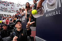 | Photo: AP/Alessandra Tarantino : Italy's Jannik Sinner signs autographs after beating Italy's Andrea Pellegrino, after their match at the Italian Open tennis tournament in Rome.