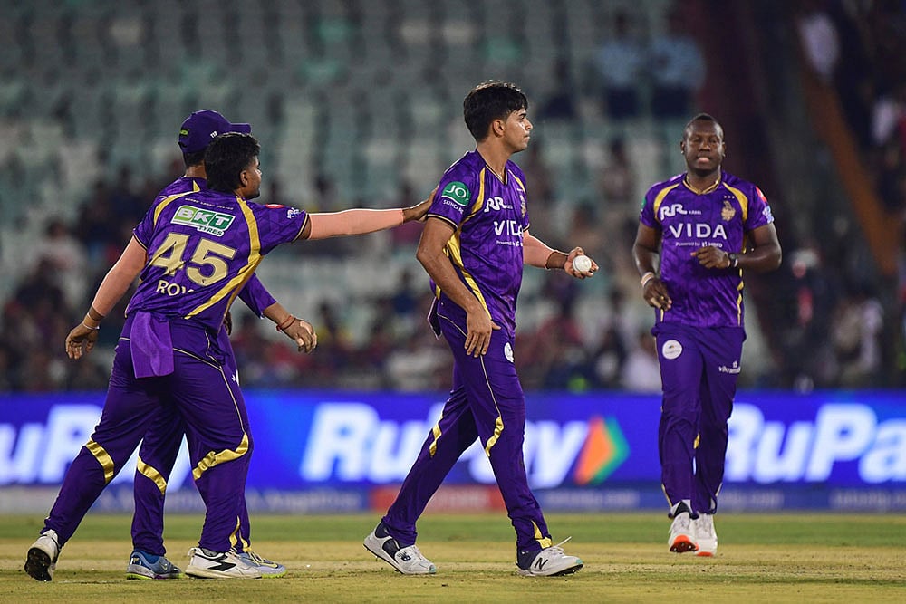 Kolkata Knight Riders' Kartik Tyagi celebrates with teammates the wicket of Royal Challengers Bengaluru's Jacob Bethell during the Indian Premier League cricket match between Royal Challengers Bengaluru and Kolkata Knight Riders in Raipur, India. - | Photo: AP/Abhijit Addya