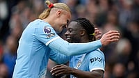 | Photo: AP/Dave Thompson : Manchester City's Jeremy Doku, right, celebrates with Manchester City's Erling Haaland after scoring the opening goal during the English Premier League soccer match between Manchester City and Brentford in Manchester.