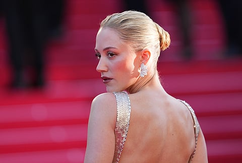 Maika Monroe poses for photographers at the opening ceremony and premiere of the film 'The Electric Kiss' during 79th international film festival, Cannes, southern France.